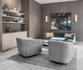 Resident lounge with velvet sofa and contemporary seating